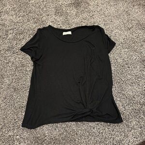 Basic black top, light and good for work, tie in front to give it something